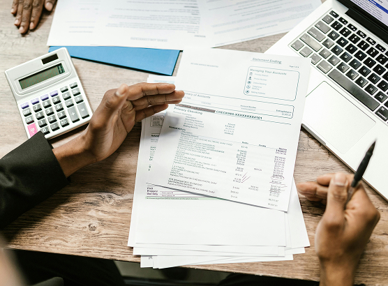 Business professional reviewing documents at a desk